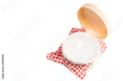 Camembert cheese in wooden box on white background