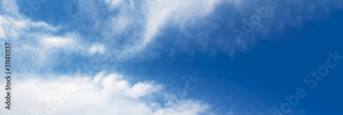 fluffy clouds in the blue sky  panoramic mock- up image