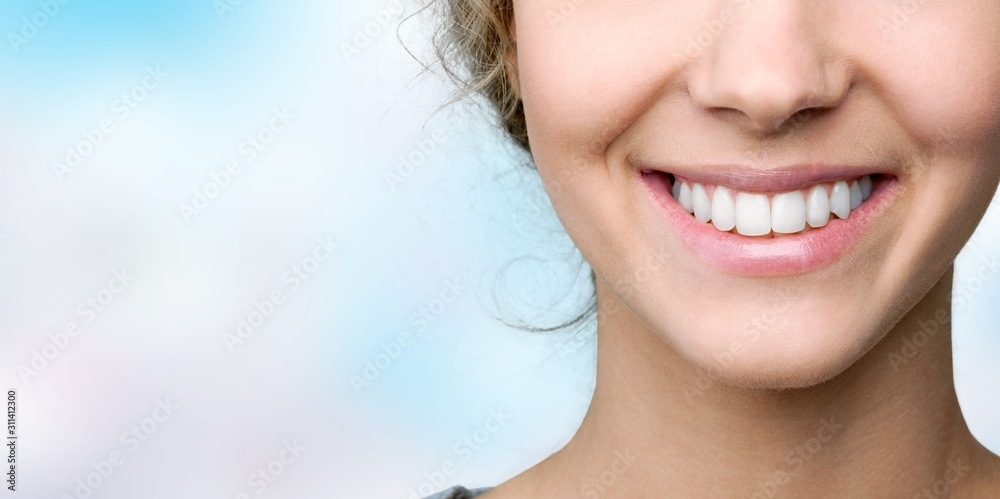 Beautiful smile of young woman with healthy white teeth - obrazy, fototapety, plakaty 