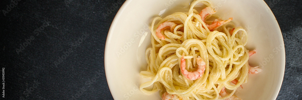 pasta shrimp (spaghetti cream sauce and seafood prawn) menu concept. food background. top view. copy space pasta shrimp (spaghetti cream sauce and seafood prawn) menu concept. food background. top view. copy space