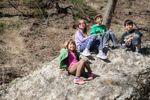 Children taking break from hiking