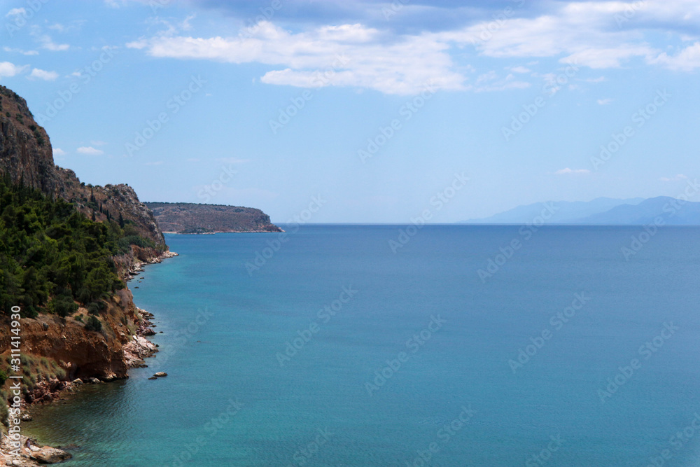 Scenic view of the boundless Mediterranean Sea and coastline with pines and rocks