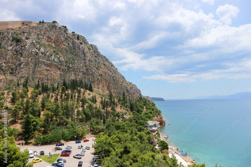 Panoramic view to the Palamidi fortress on the rock in Nafplio, Peloponnese, Greece and mediterranean sea