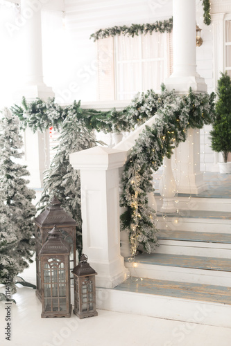 Christmas lanterns at the stairs of the house.