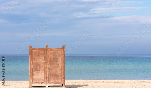 Dressing cabin on the beach. Minimal work with sea, sky and locker cabin