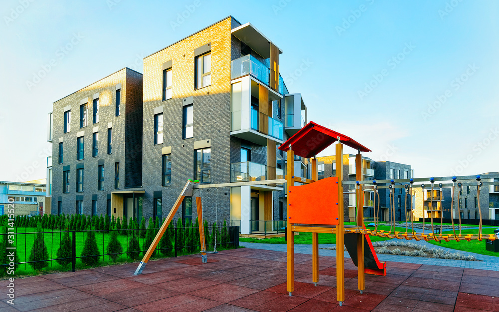 Apartment in residential building exterior. Housing structure at blue modern house of Europe. Rental home in city district on summer. Architecture for business property investment, Vilnius, Lithuania. Apartment in residential building exterior. Housing structure at blue modern house of Europe. Rental home in city district on summer. Architecture for business property investment, Vilnius, Lithuania.