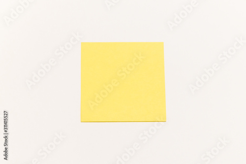 One empty yellow sticker on white background with place for text