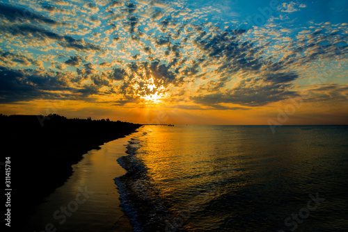 Sunset at the sea in the summer resort