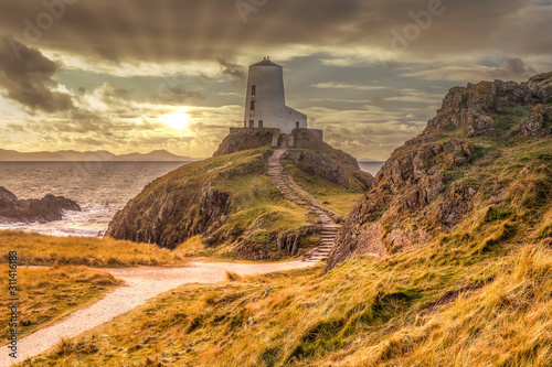 Tŵr Mawr lighthouse (meaning "great tower" in Welsh), on Ynys Llanddwyn on Anglesey, Wales, marks the western entrance to the Menai Strait.