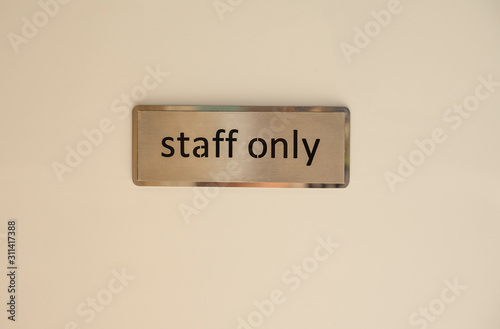 Golden staff only sign on the door