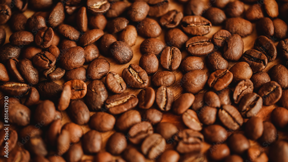 Coffee beans background. Closeup view. Background for website design or brochure on food concept. Filling for menu of cafe, restaurants, coffee shops. 16 in 9 banner crop Coffee beans background. Closeup view. Background for website design or brochure on food concept. Filling for menu of cafe, restaurants, coffee shops. 16 in 9 banner crop