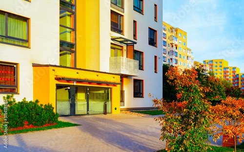 Fototapeta Naklejka Na Ścianę i Meble -  Apartment in residential building exterior. Housing structure at blue modern house of Europe. Rental home in city district on summer. Architecture for business property investment, Vilnius, Lithuania.