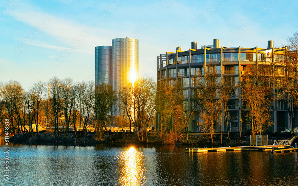 Apartment in residential building exterior. Housing structure at blue modern house of Europe. Rental home in city district on summer. Architecture for business property investment in Riga, Latvia.