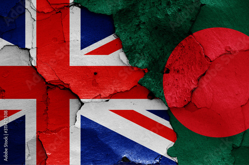 flags of UK and Bangladesh painted on cracked wall photo