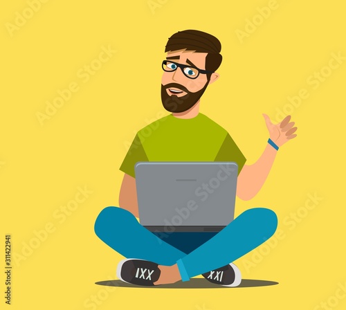 Bearded man sits on the floor and works at a laptop. Remote work via the Internet. Freelancer. Vector illustration in cartoon style