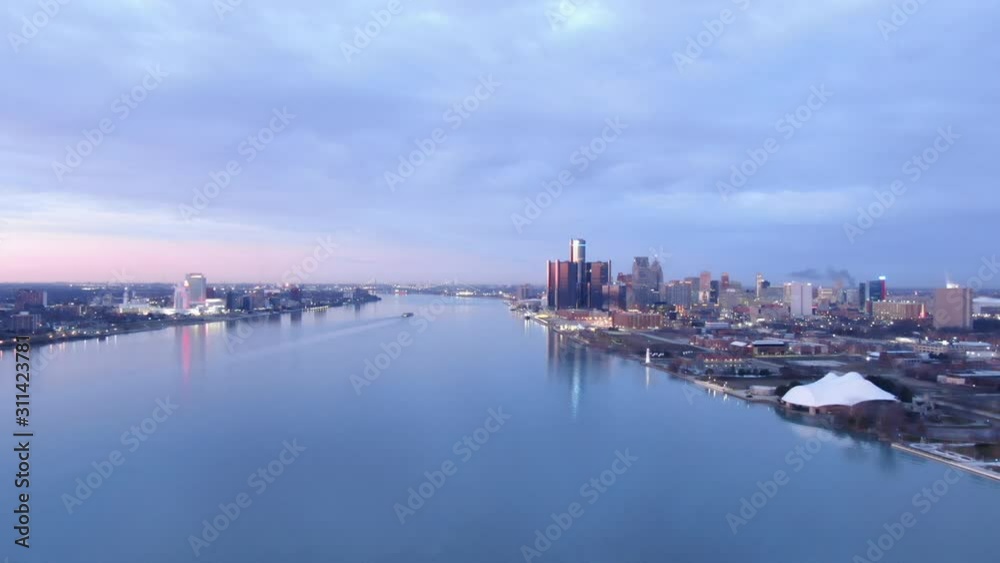 USA Michigan Detroit flying over Detroit River / Downtown Detroit / Windsor on a dark, cold, winter, morning at Sunrise