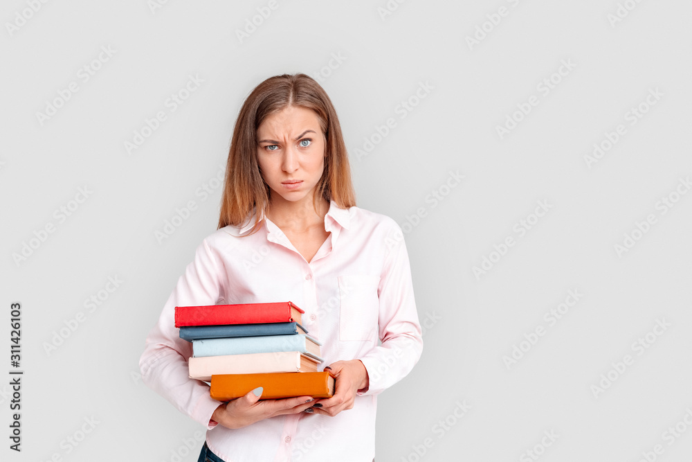 Freestyle. Young woman student standing isolated on white with looking camera concerned Freestyle. Young woman student standing isolated on white with looking camera concerned