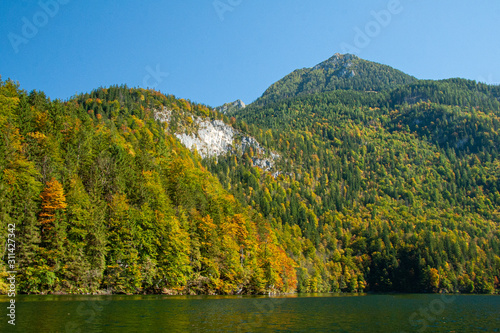 reflection of hills in koenigsee, autumn time in Bavaria, Germanhy © Tomtsya