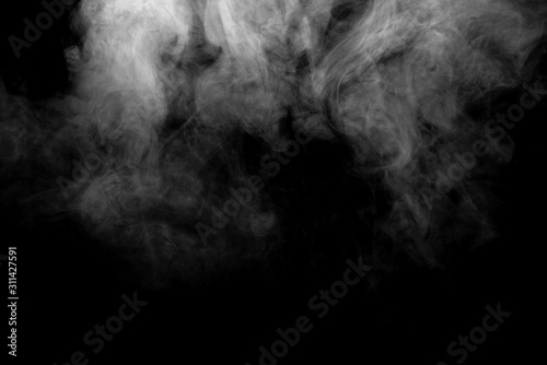 Thick white smoke on a black background.