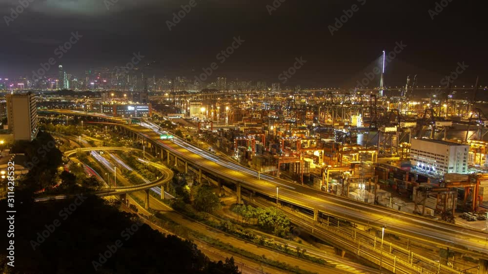 Hong Kong container port terminal and logistics center timelapse at night pan up Hong Kong container port terminal and logistics center timelapse at night pan up