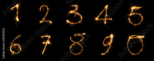 Numbers from 1 to 9 written with sparklers