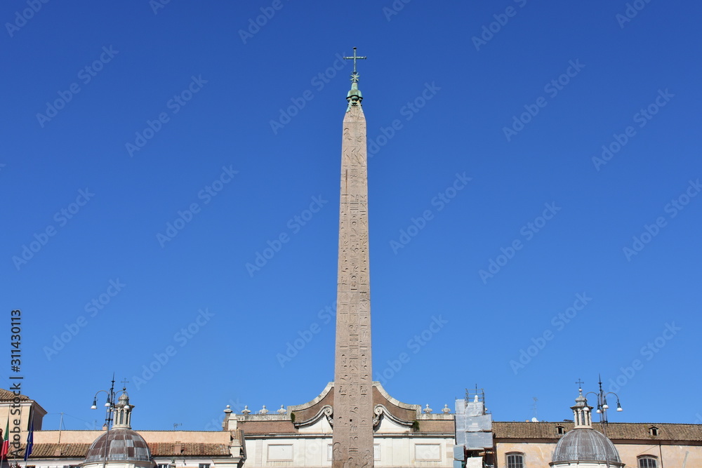 Flaminio Obelisk at Piazza del Popolo with blue sky. Rome, Italy.