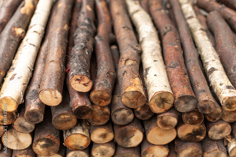 Chopped firewood logs in rows. Wood texture Chopped firewood logs in rows. Wood texture
