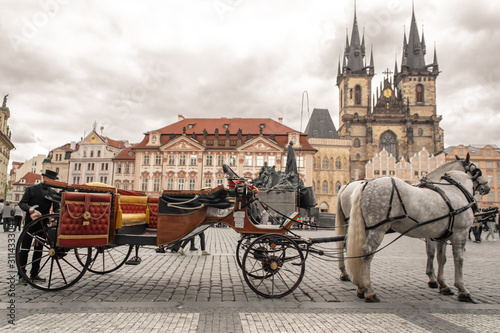 Carts with horses in the square of the old town of Prague