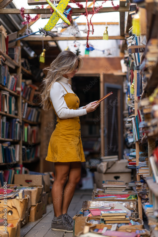 girl and book flea market