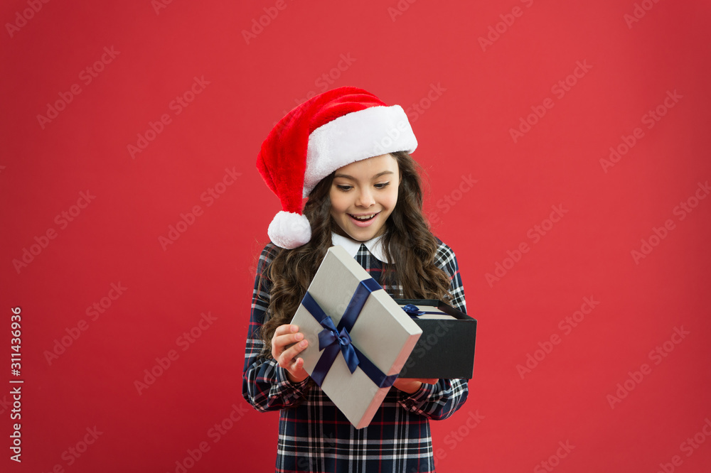 little girl open present box. happy new year gift. time for christmas holiday presents. small girl in santa hat. cheerful child red background. christmas kid shopping. best gift for xmas little girl open present box. happy new year gift. time for christmas holiday presents. small girl in santa hat. cheerful child red background. christmas kid shopping. best gift for xmas