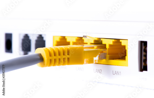 Macro of LAN ethernet port with network cable connected to router