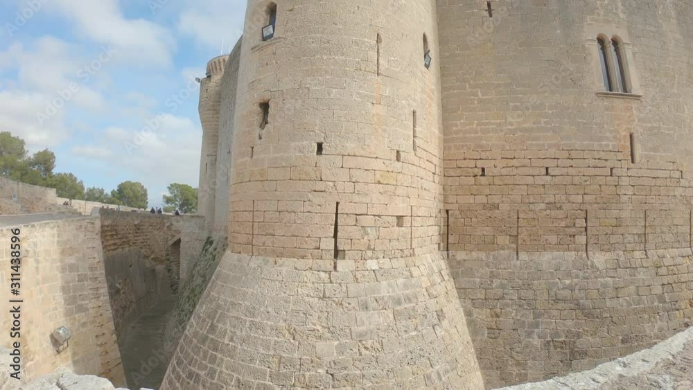 Old medieval fortress built in the 14th century. Bellver Castle, Palma de Mallorca, Balearic islands, Spain. Outside panoramic view. 4K footage. Camera movement from bottom to top Old medieval fortress built in the 14th century. Bellver Castle, Palma de Mallorca, Balearic islands, Spain. Outside panoramic view. 4K footage. Camera movement from bottom to top