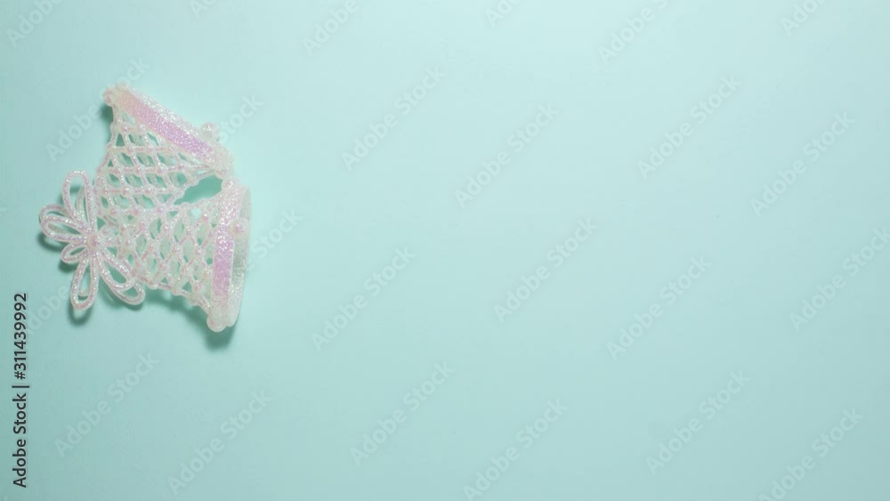 Jingle bells ringing on blue background on the left side. Flat lay stop ...