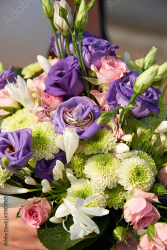 wedding bouquet with roses and rings