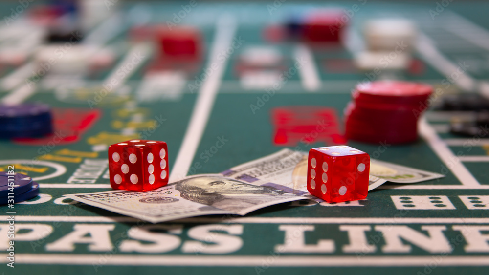 Φωτογραφία casino craps table with chips, cash, and dice
