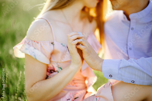 guy and girl holding each other's hands