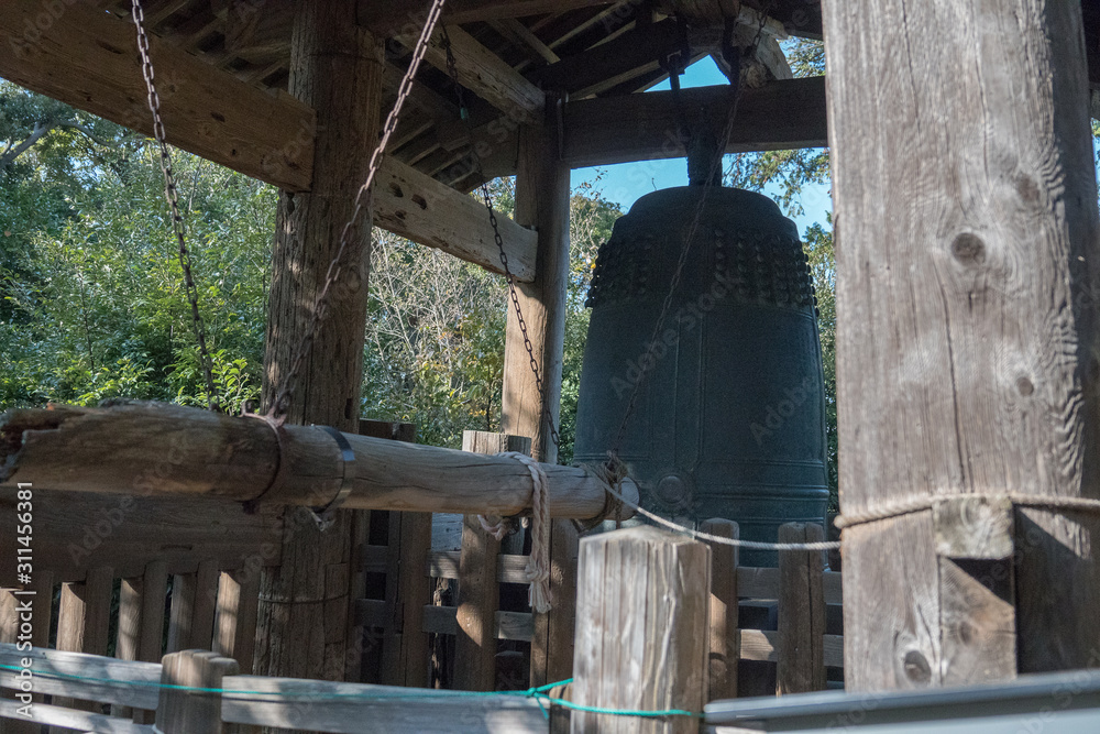 a bell atop 300 stairs at a Japanese temple