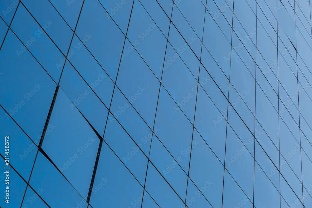 Blue glass windows of modern office building Blue glass windows of modern office building