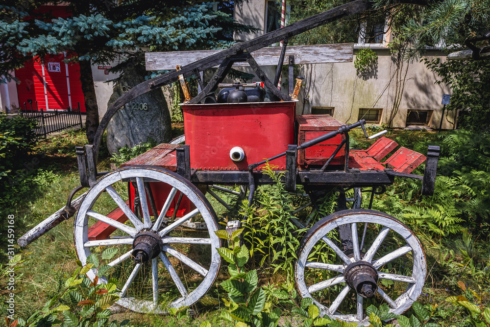 Historic fire vehicle in front of fire station in Jerzwald, small village in Masuria region of Poland
