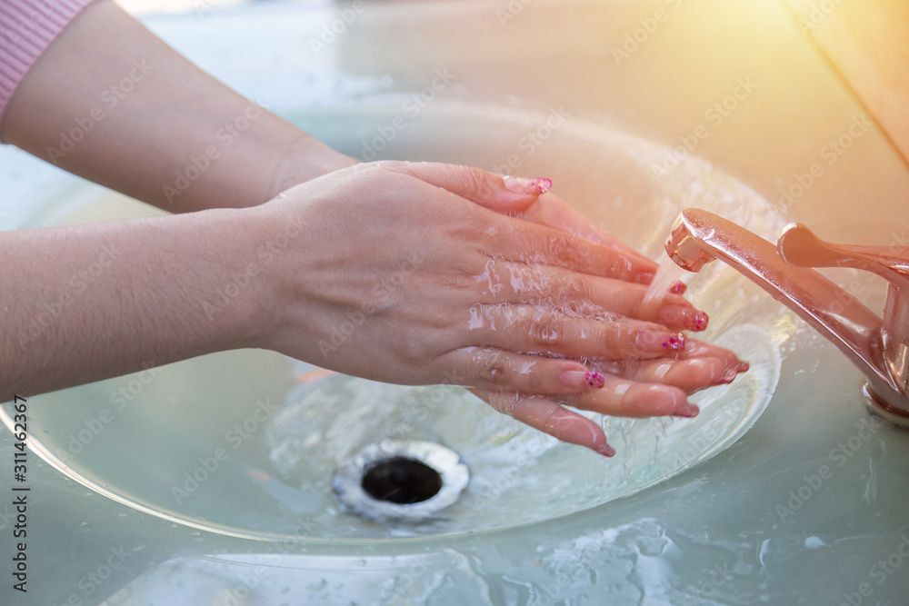 Women wash their hands properly before eating Women wash their hands properly before eating
