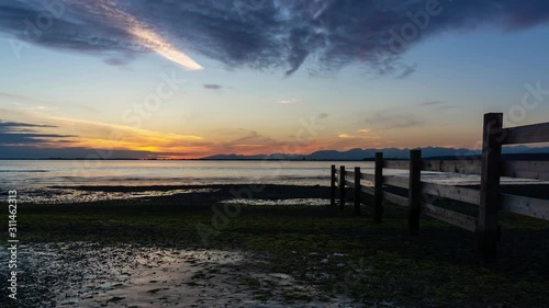 Wallpaper Mural Time Lapse of Beautiful sunset at the beach by the wooden quay. Taken in Blackie Spit, White Rock, Greater Vancouver, British Columbia, Canada. Torontodigital.ca