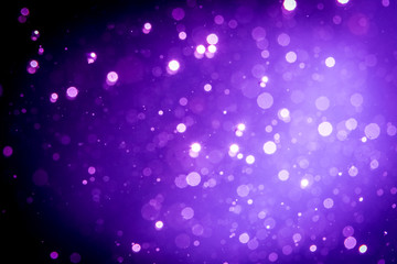 Abstract purple , violet bokeh on black