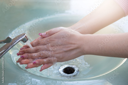 Women wash their hands properly before eating