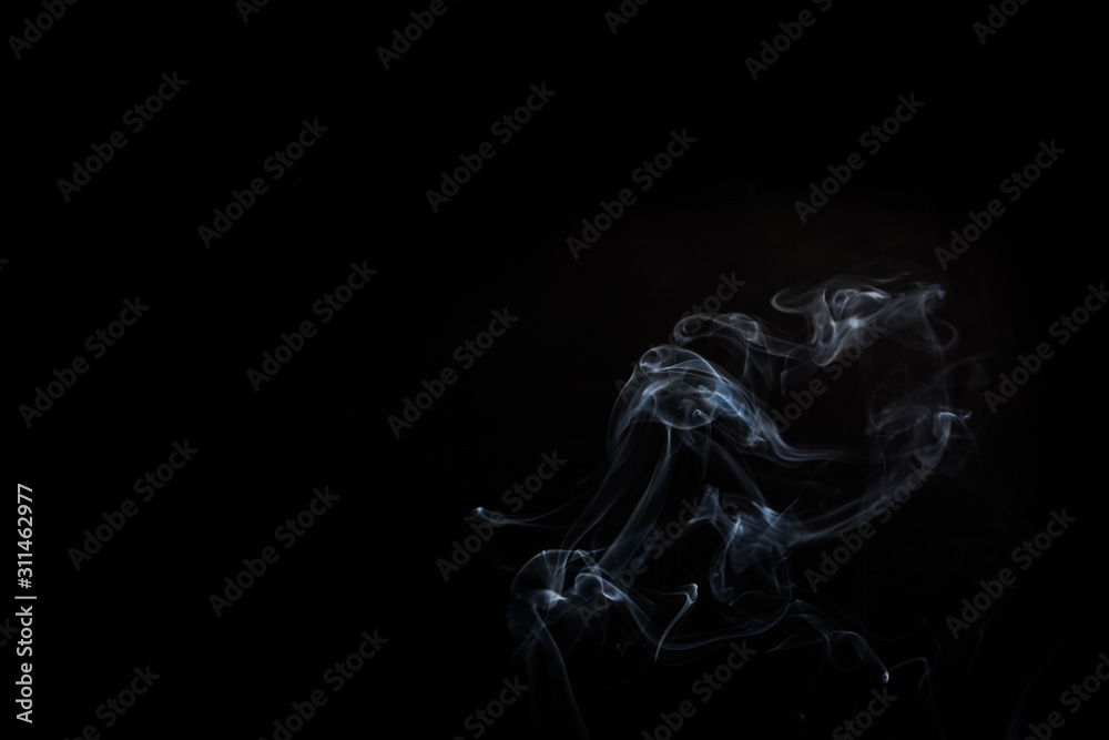 Naklejka premium Abstract smoke swirls on black