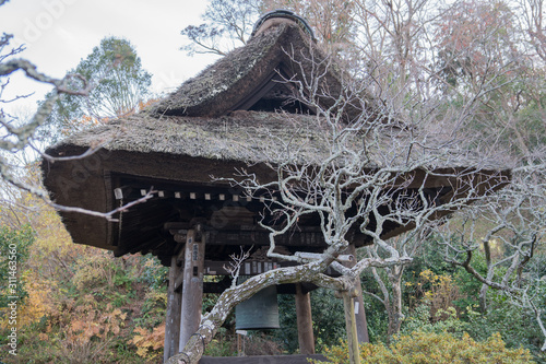 an old japanese time announcing bell at a nunnery, Translation of characters on charm is of a japanese name photo