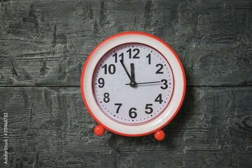 Wallpaper Mural Bright red alarm clock on wooden background. Torontodigital.ca