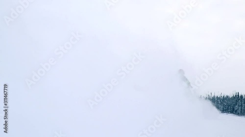 Wallpaper Mural A man enjoy the winter by doing snowmobile on a frozen lake in Canada. Torontodigital.ca