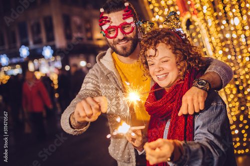 Couple with sparklers celebrating new year