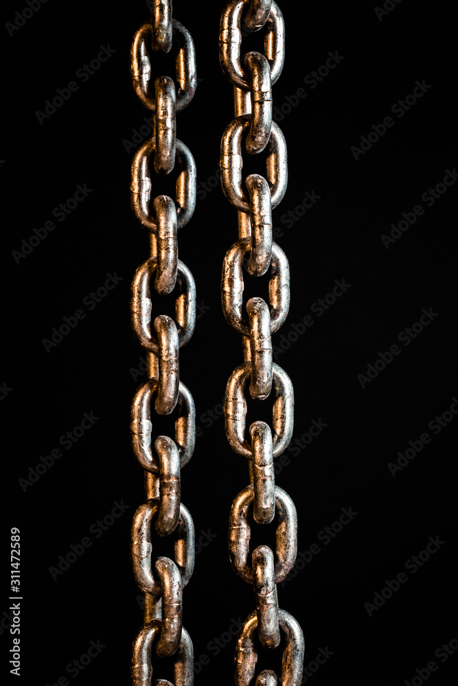 Rusty chains weathering. Chain on black background.