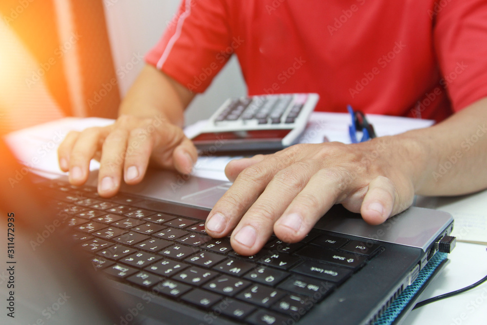 Concept Business holding pen pointing customer statistics On the desk with a graph in the office, Vintage, Sunset light.Selective Focus Concept Business holding pen pointing customer statistics On the desk with a graph in the office, Vintage, Sunset light.Selective Focus